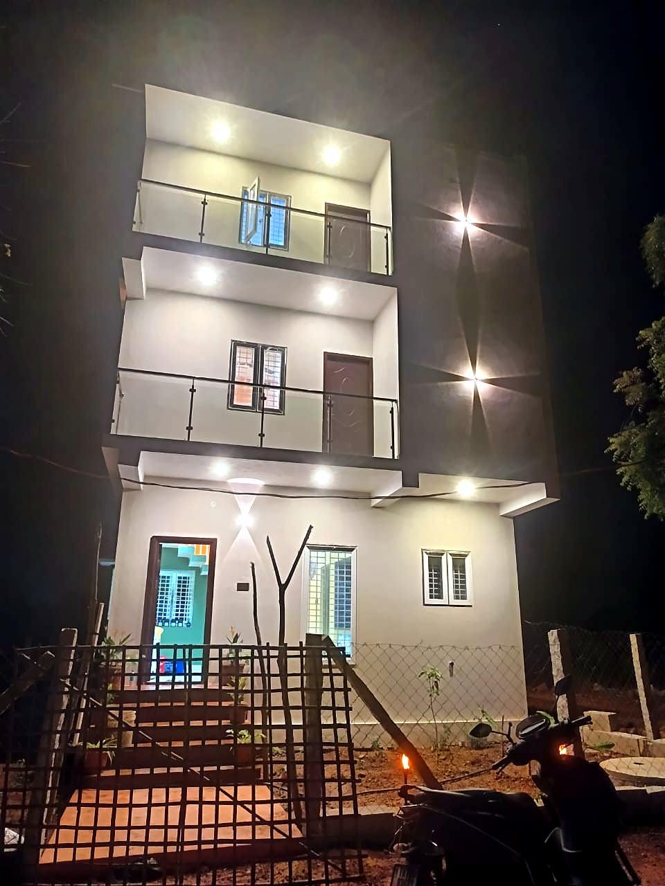 Vananta homestay building lit up at night