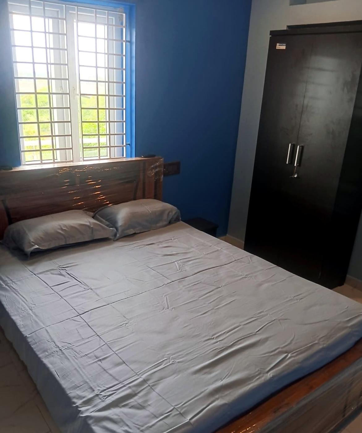 Bedroom with a window looking out at trees